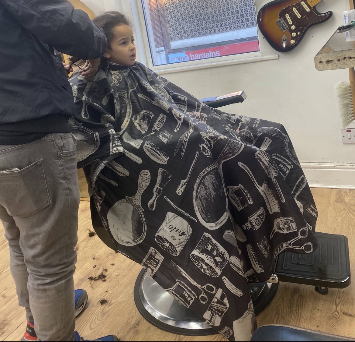Kid mid-cut in the chair